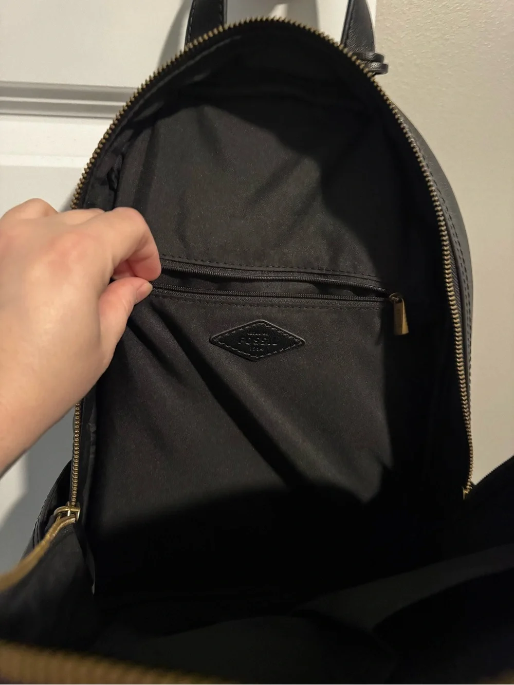 Fossil Black Leather Backpack with Gold Zip Accent